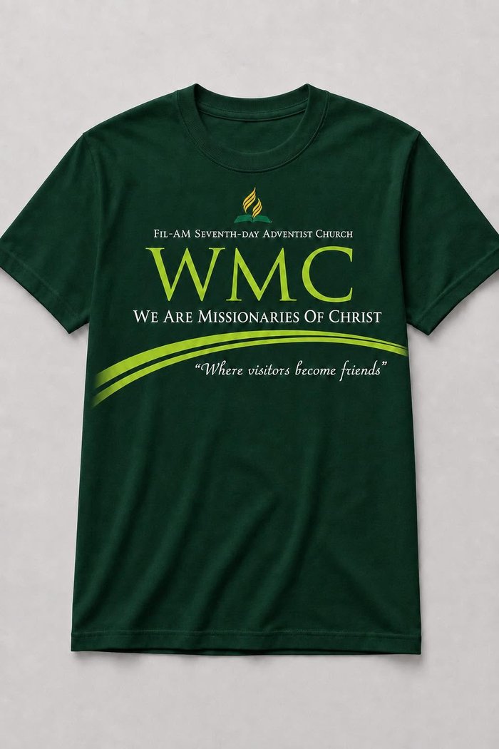 WMC Fil-Am 14th Anniversary commemorative t-shirt — forest green with lime green "WMC" wordmark and "Where visitors become friends" tagline